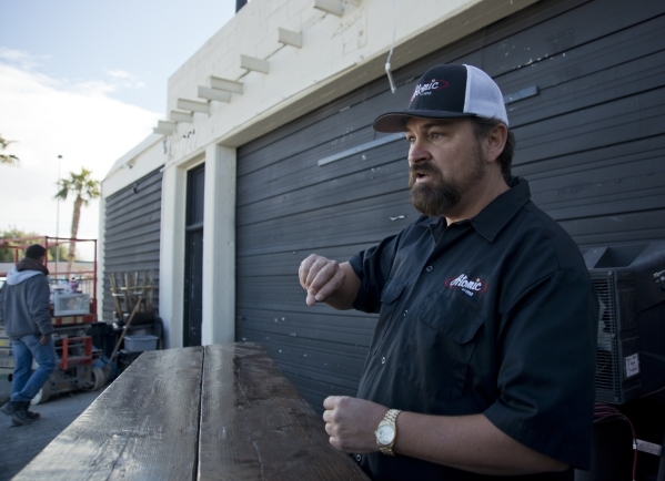 Lance Johns explains how renovations for Atomic Kitchen will work outside the garage immediately next door to Atomic Liquors, in Downtown Las Vegas on Friday, Jan. 15, 2016. His project is experie ...