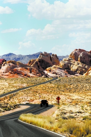 A car passes through the Valley of Fire on Saturday, June 13, 2015, in Overton. Nevada opened up all 23 of their state parks for one day without an admission fee. (James Tensuan/Las Vegas-Review J ...