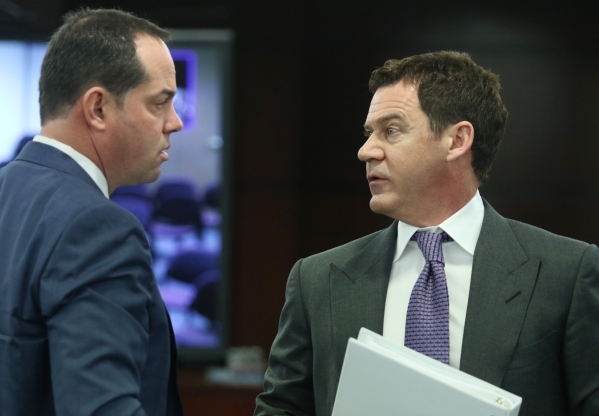 Station Casinos‘ Marc Falcone, left, chief financial officer, exchanges words with Richard Haskins, president, during a Gaming Control Board hearing at Grant Sawyer building Thursday, Jan. 2 ...