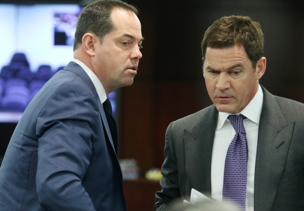 Station Casinos‘ Marc Falcone, left, chief financial officer, exchanges words with Richard Haskins, president, during a Gaming Control Board hearing at Grant Sawyer building Thursday, Jan. 2 ...