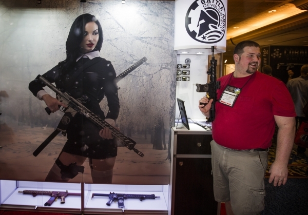 Jeffrey Anstey holds a gun in the Battle Arms Development booth during the Shot Show at the Sands Expo on Tuesday, Jan. 19, 2016. Jeff Scheid/Las Vegas Review-Journal Follow @jlscheid