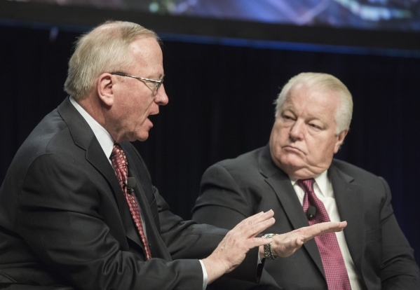 Michael Boyd, left, president of Boyd Group International,  speaks while Roger Dow, president & CEO of the U.S. Travel Association listens during l discussing at Preview in the Cox Pavilion on ...