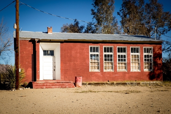 In the center of the site is Freeman Hall, a former schoolhouse approximately 20-feet-by-25-feet with a galvanized steel roof, fluorescent lights in the vaulted ceiling and a pinewood floor. No lo ...