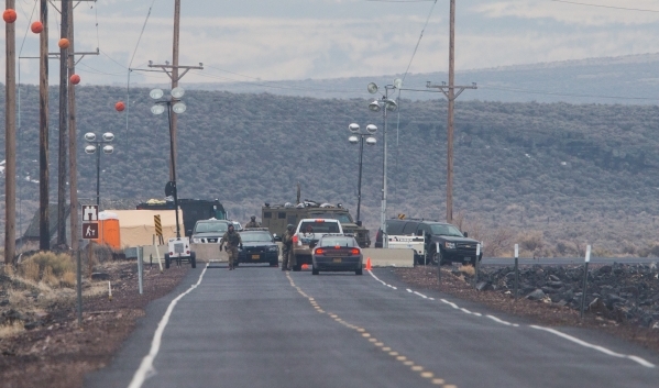 A police roadblock is shown outside of the Malheur National Wildlife Refuge, where four anti-government protestors remain, about 30 miles south of Burns, Ore., on Thursday, Jan. 28, 2016. The lead ...