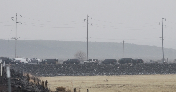 A large group of law enforcement vehicles are shown at a roadblock outside of the Malheur National Wildlife Refuge, where four anti-government protesters remain, about 30 miles south of Burns, Ore ...