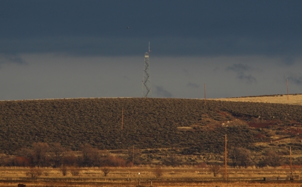 The watchtower at the Malheur National Wildlife Refuge headquarters, where four anti-government protesters remain, about 30 miles south of Burns, Ore., is shown in the distance on Thursday, Jan. 2 ...