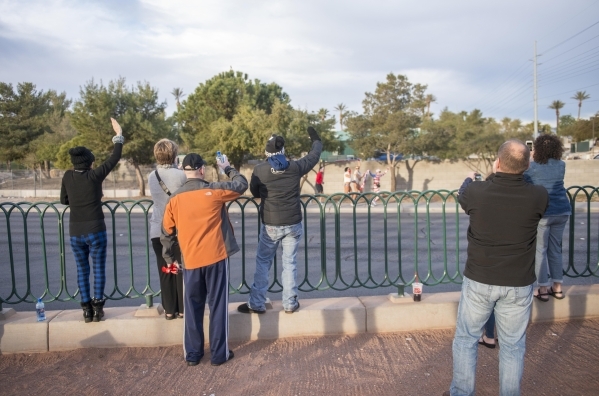 Supporters of Helene Neville cheer as she runs from the South Strip "Welcome to Las Vegas" sign to downtown‘s "Welcome to Las Vegas" sign on Friday, Jan. 29, 2016. (Jacob ...