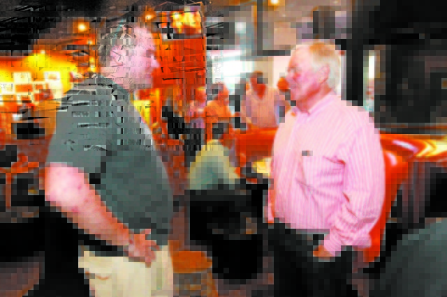 Bill Foley talks to hockey fan John Jacob Jordan at an event to promote season ticket sales for a potential NHL franchise Tuesday, March 24, 2015 at Born and Raised bar. (Sam Morris/Las Vegas Revi ...