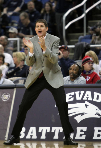 Runnin’ Rebel head coach Dave Rice calls in a play during the first half of their NCAA basketball game with the Nevada Wolf Pack at Lawlor Events Center. Mandatory Credit: Lance Iversen-USA TODA ...