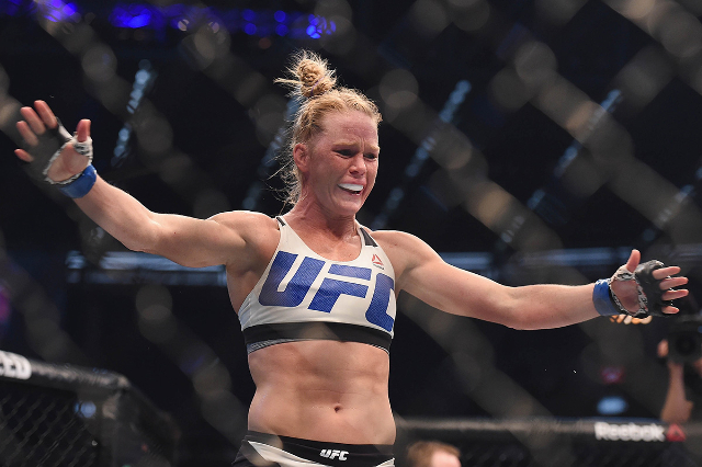 Nov 15, 2015; Melbourne, Australia; Holly Holm (blue gloves) celebrates after defeating Ronda Rousey (not pictured) during UFC 193 at Etihad Stadium. Mandatory Credit: Matt Roberts-USA TODAY Sports