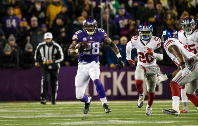 Dec 27, 2015; Minneapolis, MN, USA; Minnesota Vikings running back Adrian Peterson (28) carries the ball during the third quarter against the New York Giants at TCF Bank Stadium. The Vikings defea ...