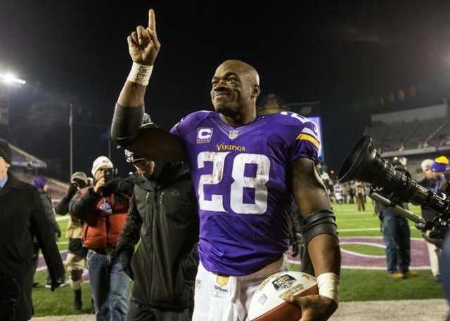 Dec 27, 2015; Minneapolis, MN, USA; Minnesota Vikings running back Adrian Peterson (28) acknowledges the fans following the game against the New York Giants at TCF Bank Stadium. The Vikings defeat ...