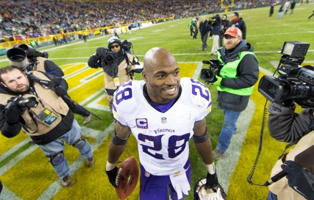 Jan 3, 2016; Green Bay, WI, USA; Minnesota Vikings running back Adrian Peterson (28) walks from the field following the game against the Green Bay Packers at Lambeau Field.  Minnesota won 20-13. ( ...