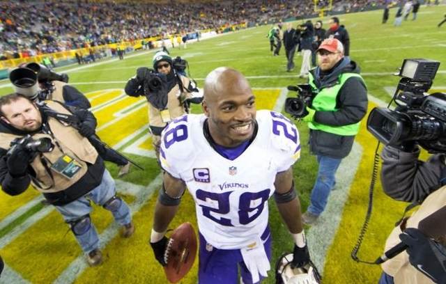 Jan 3, 2016; Green Bay, WI, USA; Minnesota Vikings running back Adrian Peterson (28) walks from the field following the game against the Green Bay Packers at Lambeau Field. Minnesota won 20-13. ( ...