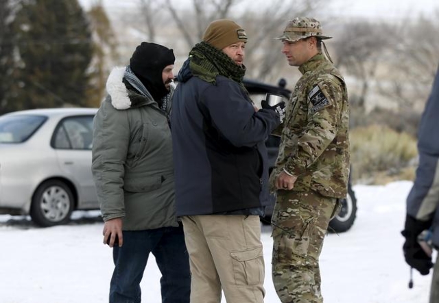 Militiamen stand on a road at the Malheur National Wildlife Refuge near Burns, Oregon, January 4, 2016. The leaders of a group of self-styled militiamen who took over a U.S. wildlife refuge headqu ...