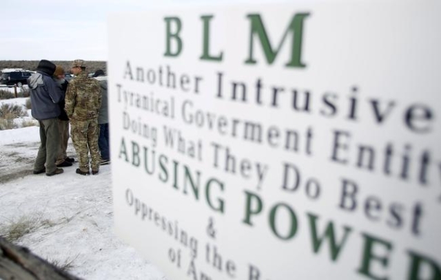 Militiamen stand on a road at the Malheur National Wildlife Refuge near Burns, Oregon, January 4, 2016. The leaders of a group of self-styled militiamen who took over a U.S. wildlife refuge headqu ...