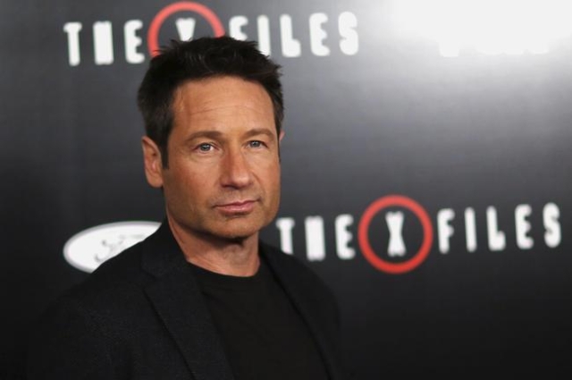 Cast member David Duchovny poses at a premiere for "The X-Files" at California Science Center in Los Angeles, California January 12, 2016. A 6-episode series premieres on January 24. (Ma ...