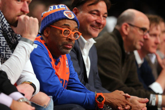 Jan 13, 2016; Brooklyn, NY, USA; American actor and director Spike Lee sits  courtside during the second quarter between the New York Knicks and the  Brooklyn Nets at Barclays Center. Mandatory Cred …