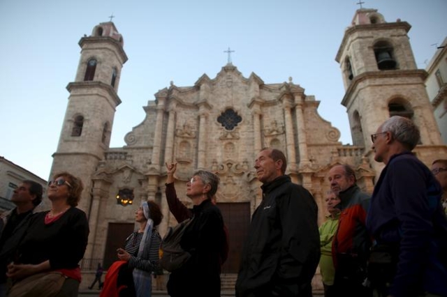 Tourists from Spain take a guided tour in old Havana, January 25, 2016. REUTERS/Alexandre Meneghini