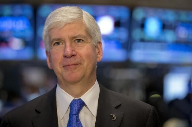 Michigan Governor Rick Snyder gives an interview on the floor of the New York Stock Exchange May 8, 2015. (Brendan McDermid/Reuters)