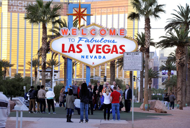 Tourists take photos of themselves at the Welcome to Fabulous Las Vegas sign on Tuesday, Nov. 25, 2014, in Las Vegas. (David Becker/Las Vegas Review-Journal)