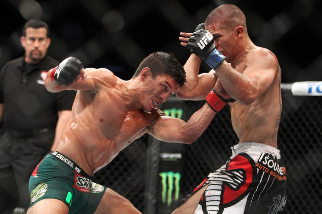Joseph Benavidez hits John Moraga with a left during their fight at UFC 187 Saturday, May 23, 2015, at the MGM Grand Garden Arena. Benevidez won by unanimous decision. (Sam Morris/Las Vegas Review ...