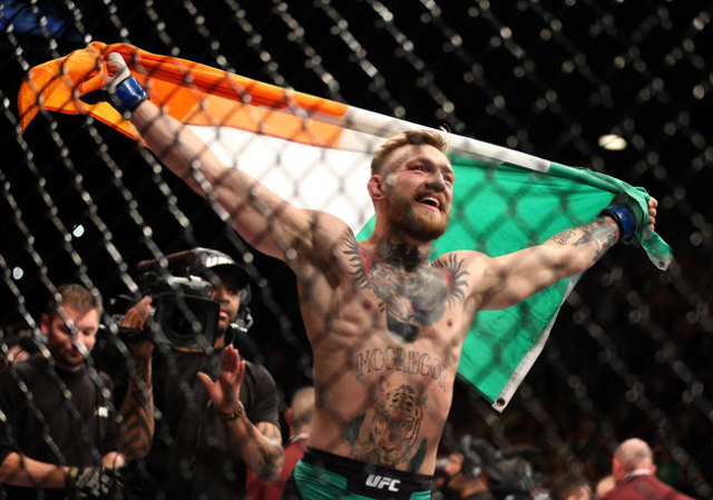 Conor McGregor celebrates after his defeat of Jose Aldo  by a first round knock out during a featherweight title bout at UFC 194 at the MGM Grand Garden Arena on Saturday, Dec. 12, 2015, in Las Ve ...