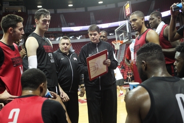 UNLV head coach Dave Rice, center, talks with the team during the Scarlet and Gray scrimmage at the Thomas & Mack Center in Las Vegas on Thursday, Oct. 15, 2015. Chase Stevens/Las Vegas Review ...
