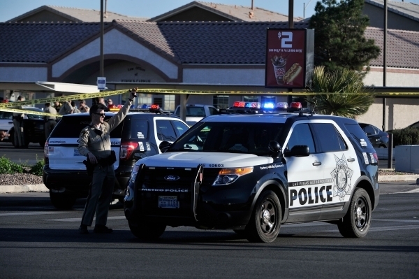 Las Vegas police investigate an officer-involved shooting along North Pecos Road near Bonanza Road on Tuesday, Jan. 26, 2016, in Las Vegas. (David Becker/Las Vegas Review-Journal)