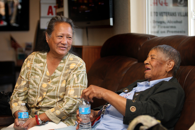 In the offices of Veterans Village, Cynthia Kamale Dias, left, who was a Navy corpsman in Vietnam, shares a laugh with 83-year-old Violet Young, who was in the Women‘s Army Corps during the  ...