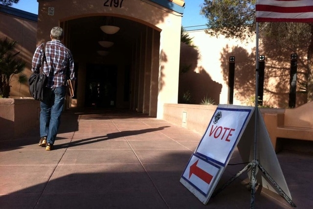 A sign directs voters to the polling place at the Green Valley Library in Henderson on Tuesday, April 7, 2015. (Michael Quine/Las Vegas Review-Journal)