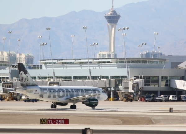 A Frontier Airlines aircraft taxis shortly after landing at McCarran International Airport Friday, July 24, 2015, in Las Vegas. (Ronda Churchill/Las Vegas Review-Journal)