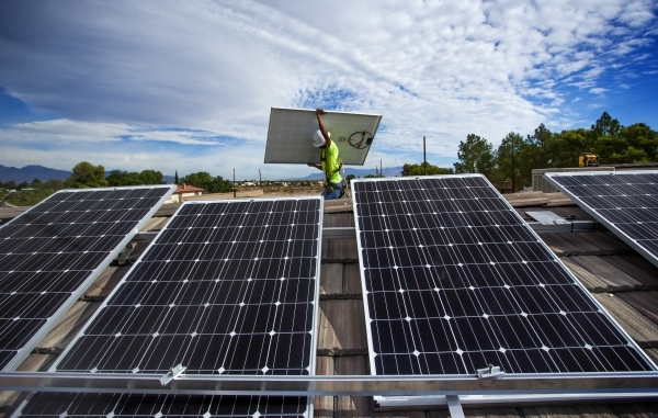 Justin Henderson with Robco Electric installs solar panels on a home in southwest Las Vegas on Wednesday, Aug. 5, 2015. (Jeff Scheid/Las Vegas Review-Journal. Follow @JLScheid)