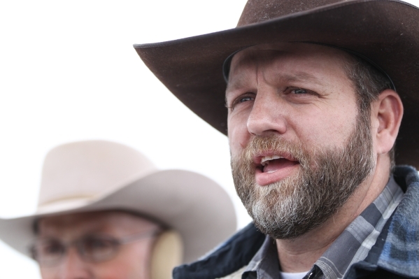 Ammon Bundy speaks with reporters at a news conference by the entrance of Malheur National Wildlife Refuge headquarters near Burns, Ore. on Tuesday, Jan. 5, 2016. Bundy, who is the son of Nevada R ...