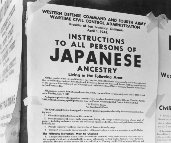 An exclusion order posted in April 1942 in San Francisco instructs people of Japanese ancestry that they must leave the area and be moved to war relocation centers. DOROTHEA LANGE/JAPANESE AMERICA ...