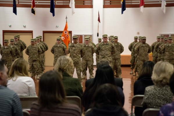 Soldiers of the 422nd Expeditionary Signal Battalion stand in formation in front of their friends and family during a mobilization ceremony at the Clark County Armory in Las Vegas on Thursday, Feb ...