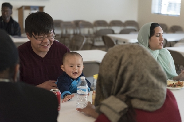 Eugene Lee, left, holds his 10-month-old son Isaac Lee during a neighborhood get together for Masjid Ibrahim‘s opening weekend in Las Vegas Saturday, Jan. 30, 2016. Jason Ogulnik/Las Vegas R ...