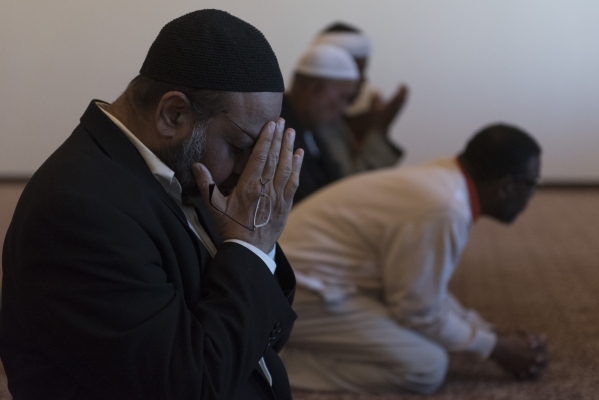 Dr. Aslam Abdullah, left, is seen during a prayer session at Masjid Ibrahim during a neighborhood get together for the mosque‘s opening weekend in Las Vegas Saturday, Jan. 30, 2016. Jason Og ...