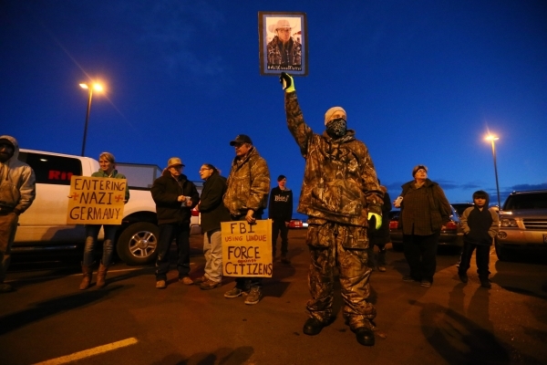 People gather for a "rolling" protest of the shooting death of LaVoy Finicum, who was killed Tuesday night during an attempted arrest by FBI and Oregon State Police officers, outside of  ...