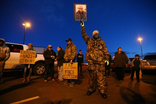 People gather for a "rolling" protest of the shooting death of LaVoy Finicum, who was killed Tuesday night during an attempted arrest by FBI and Oregon State Police officers, outside of ...