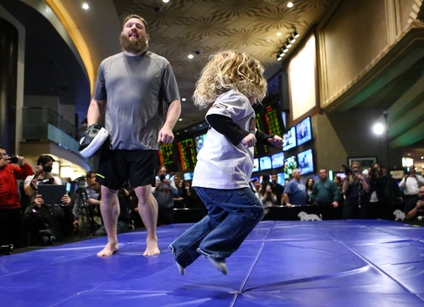 Roy Nelson, left, with his son Jaxson, 3, participates in an open workout ahead of UFC Fight Night 82 at the MGM Grand hotel-casino in Las Vegas on Thursday, Feb. 4, 2016. Chase Stevens/Las Vegas ...