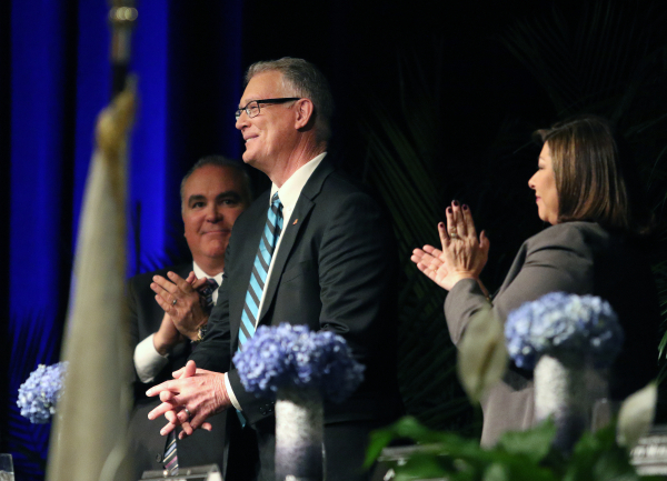 Henderson Mayor Andy Hafen, center, receives applause from Henderson Chamber of Commerce Chairman Tim Brooks, left, and councilwoman Gerri Schroder after delivering the annual State of the City ad ...
