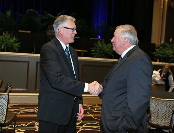 Henderson Mayor Andy Hafen, left, speaks with Michael Richards, president of College of Southern Nevada, after the mayor delivered the annual State of the City address at Green Valley Ranch hotel- ...