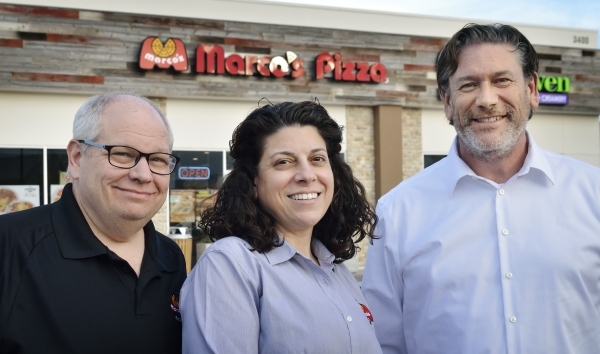 Bryon Stephens, president and chief operating officer at MarcoþÃôs Pizza, who was also featured on þÃúUndercover BossþÃù on CBS, right, is shown with franchisees and are ...