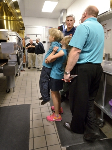Andrew Stewart, left, gets a boost from his sister Ellie as they watch a pizza emerge from the oven at MarcoþÃôs Pizza at 3400 S. Hualapai Way in Las Vegas on Thursday, Feb. 4, 2016. The ...