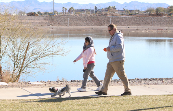 Don and his wife, Regina, of San Diego, who didn‘t want to give their last name, walk their dog, Alaska, during a sunny morning at Cornerstone Park on Wednesday, Feb. 3, 2016, in Henderson.  ...