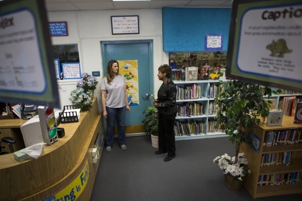 Librarian Stacy Moore, left, and Pamela Goynes-Brown, assistant principal at Lomie Heard Elementary School and North Las Vegas City Council member, gives a tour of Lomie Heard Elementary School in ...
