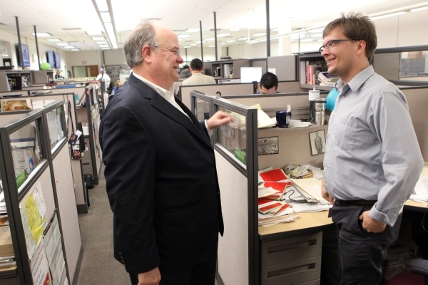 Las Vegas Review-Journal Editor J. Keith Moyer, left, visit with reporter Ben Botkin in the Review-Journal newsroom in Las Vegas after being introduced as editor Friday, Feb. 5, 2016. K.M. Cannon/ ...