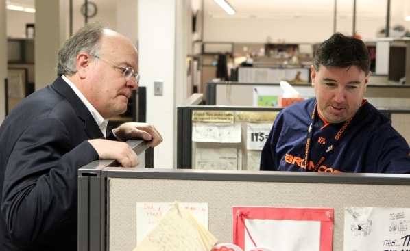 Las Vegas Review-Journal Editor J. Keith Moyer, left, visits with editorial writer Patrick Everson in the Review-Journal newsroom in Las Vegas after being introduced as editor Friday, Feb. 5, 2016 ...