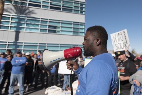 SolarCity Installer Chris James, right, speaks to solar workers and supporters protesting outside of the Public Utilities Commission office at 9075 W. Diablo Dr. in Las Vegas Monday, Feb. 8, 2016. ...